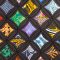 Viola Canady’s colorful quilt, with bright patterned fabric set in a black, cathedral-window grid.